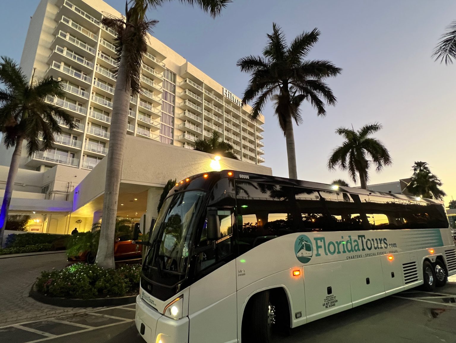 Motorcoach waiting at the Hilton hotel entrance